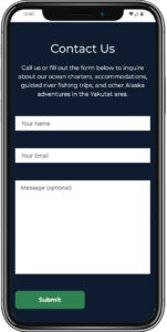 mobile phone open to the Contact page of Glacier Bear Lodge's website